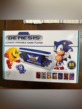 Genesis Ultimate Portable Game Player - White and Blue. New in box
